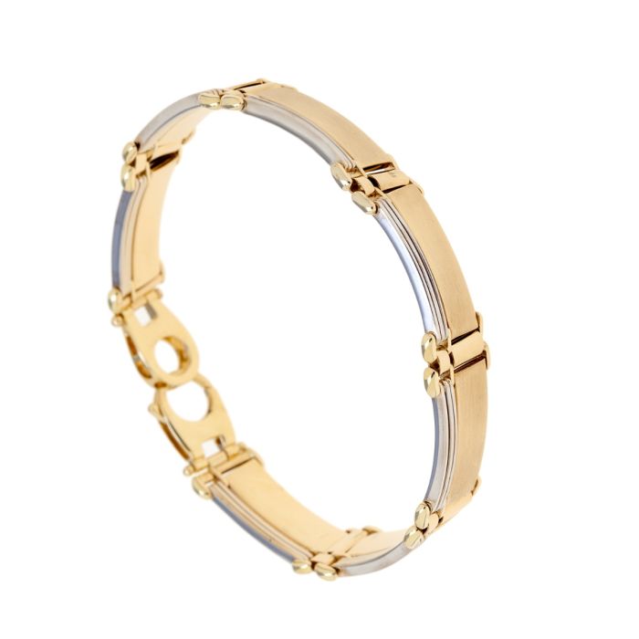 Modernes Bicolorarmband aus 14-karätigem Gelb- und Weißgold. 
Schlichte, mattierte aneinandergereihte Platten, die nebenliegend von schmalen, stabförmigen, weißgoldenen Elementen begleitet werden.