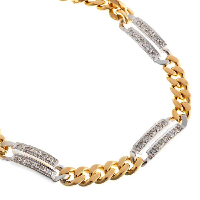 Gliederarmband in 14-karätigem Bicolor-Gold. Zwischen den  Gliedern befinden sich 4 größere weißgoldene Glieder,  die mit jeweils 10 Diamanten besetzt sind.
