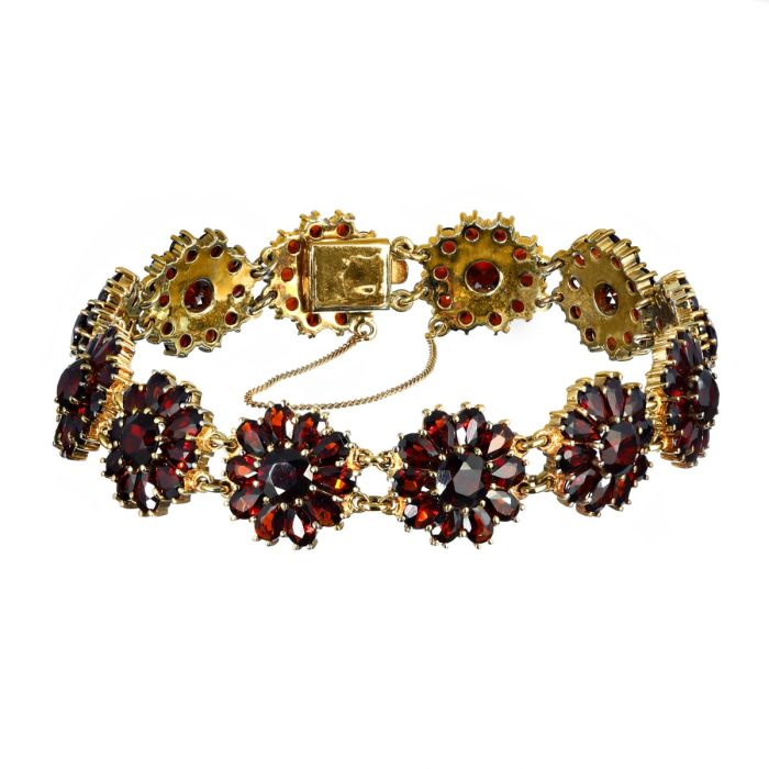 Granat-Armband aus 12 granatbesetzten Blütenelementen 333er Gelbgold 