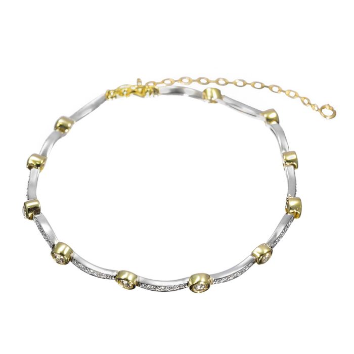 Brillantarmband in Bicolor mit wellenartig geschwungenen Zwischenelementen besetzt mit jew. 5 kleinen Brillanten und beweglich montiert an 11 Rundgliedern, die die Trommelfassung für 11 größere Brillanten bilden. In 750er Gelbgold und Weißgold