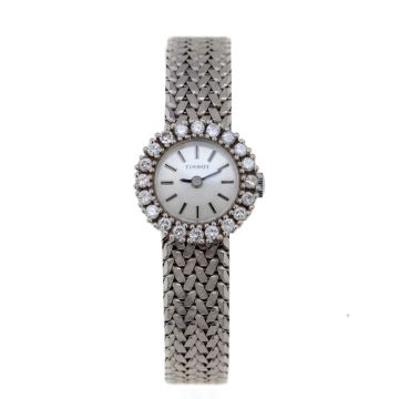 Vintage Damen-Armbanduhr in 585er Weißgold von Tissot / Schweiz um 1960, Lünette besetzt mit 20 Brillanten zus. ca. 0,60 ct. (Weiß, Si2). Zifferblatt mit Strichen als Indizes, massives Schmuckband schauseitig mattiert mit Clipverschluss