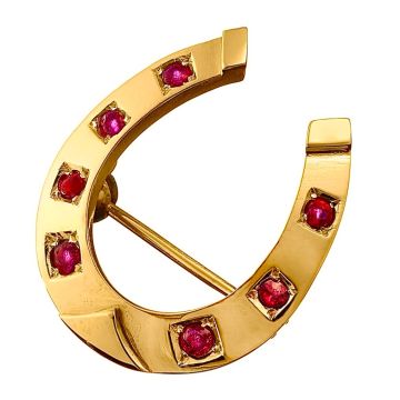 Brosche  in Hufeisen-Form aus 585er Rotgold besetzt mit 7 Rubin-Cabochons in viereckiger Körnerfassung