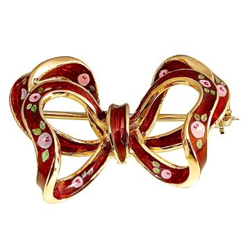 Jugendstil-Brosche aus 750er Gelbgold in Form einer Schleife mit rotem Transluzid-Email und fein gemalten rosa Rosen. 